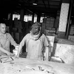 Huntley and Palmer Biscuits: Boys in biscuit factory seen here loading crate for export