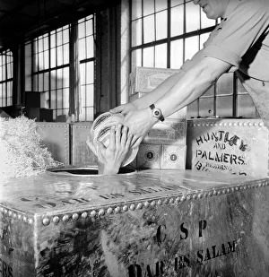 Huntley and Palmer Biscuits: Boys in biscuit factory seen here loading crate for export