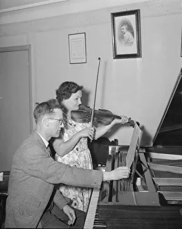 Musical Instrument Prints: Husband and wife Mr and Mrs Higgins seen here making their own entertainment