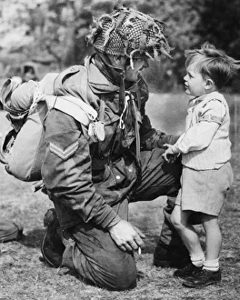 Can i be a paratrooper when i grew up? asks a small boy who has been watching paratroops