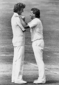 01428 Prints: Ian Botham and Bob Willis laughing together during match - August 1983