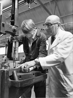 00054 Prints: Ian Scarfe YTS trainee at NEI Reyrolles Hebburn receives tuition from instructor Ronald