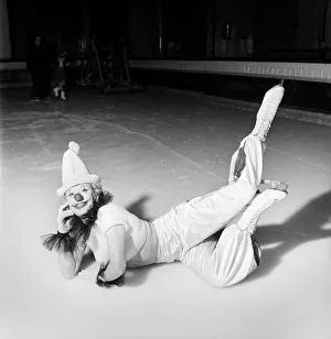 00008 Prints: An Ice Skating female Clown performing, lying down. January 1953 D597-008