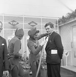 Demonstration Prints: Ideal Home Exhibition Olympia. 3rd March 1955 A journalist is hoovered by a sales
