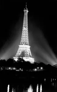 Paris Prints: Image shot from across the River Seine showing the illuminated he Eiffel Tower
