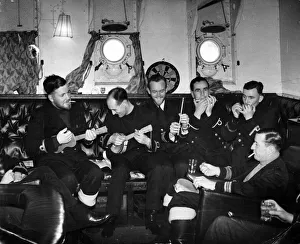 An impromptu concert in the wardroom of a British ship in a Royal Navy convoy inn