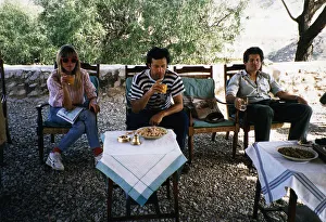 Imran Khan Cricket Sitting in chair outside house drinking with Suzannana Constantine