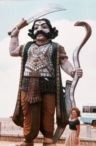 India Prints: India Demon Mahisha with sword and cobra guards the approach to a hill temple near Mysore