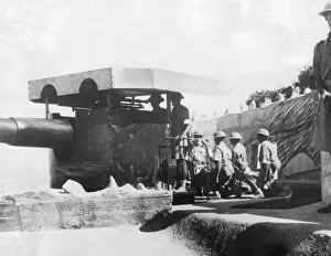 00075 Prints: An Indian gun crew working one of Hong Kongs coast defence guns as they prepare for