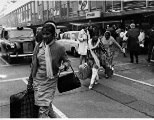 Indian and Pakistani immigrants arrive onto British soil at Heathrow Airport