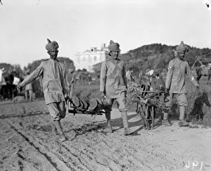 Indian troops seen off loading equipment from transports on their arrival at their rest