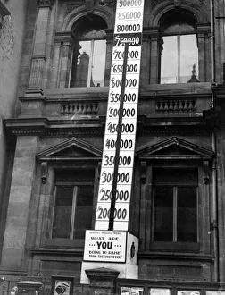 01434 Prints: The indicator shows the success of a National Saving Week at Newport, Wales. March 1942