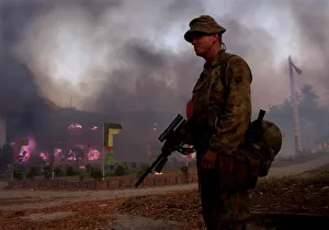 Indonesian Army burn their HQ as they leave Dilli Under the gaze of United Nation