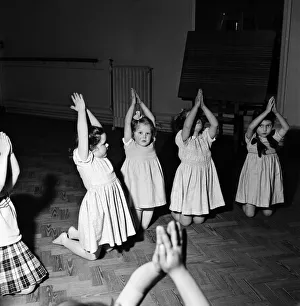 Physical Education Prints: Infant schoolchildren playing during a dance and movement class. Feburary 1953 D715-005