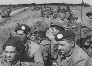 Infantry of the 3rd Monmouthshire Regiment aboard Sherman tanks of the 2nd Fife