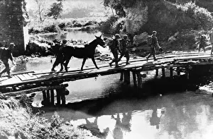 US infantry of Mars Task Force cross temporary bridge in Burma during WW2