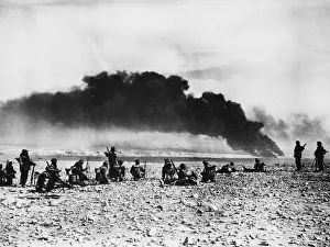 01462 Prints: Infantry waiting to advance into Tobruk which is seen in the background with fires