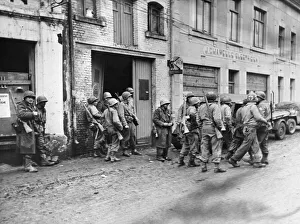 Ardennes Prints: Infantrymen gather in Bastogne, Belgium to regroup after being cut away from their