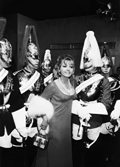 Formal Evening Prints: Ingrid Pitt surrounded by a group of Household Cavalry - July 1970 Dbase MSI