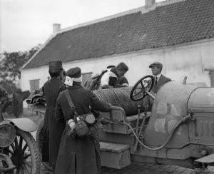 Injured Belgian soldiers seen here getting into a motor car prior to being transported