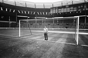 01130 Prints: Injured Liverpool footballer Gordon Milne looks out over Wembley Stadium as his teammates