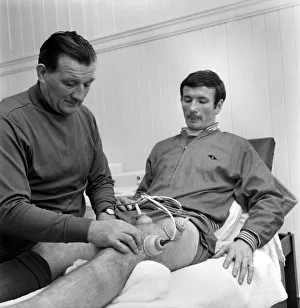 00254 Prints: Injured Liverpool player Tommy Smith receives treatment from Bob Paisley in the treatment