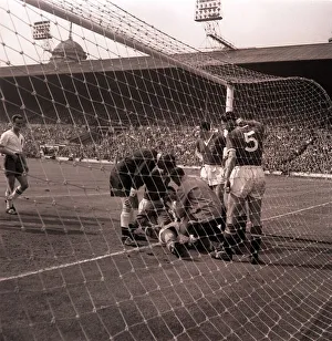 The injured Manchester United goalkeeper, Gregg, receiving attention after