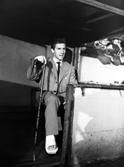 00440 Prints: Injured Tottenham Hotspur footabller Cliff Jones watches his team in action against