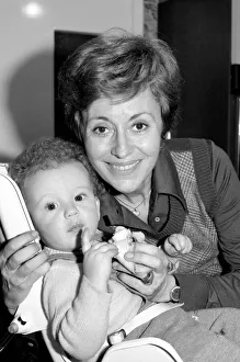 International singer star: Caterina Valente serenades her son. February 1975 75-00827-006