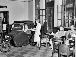Disability Prints: A invalid car owner drives through the open door of the Brighton railway street