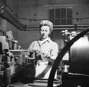 00011 Prints: Invention Increases Production - Leyland Motors Ltd Mrs Joan McManmon shows the devices