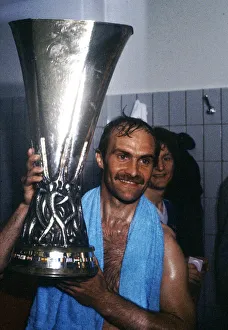 Ipswich Town captain Mick Mills holds aloft the UEFA Cup trophy after his side defeated