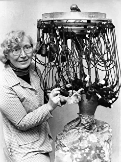 Irene Douglas with her strange looking antique permanent waving electrical outfit