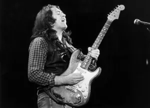 One Mid Adult Man Only Prints: Irish blues rock musician and singer Rory Gallagher piuctured performing in concert