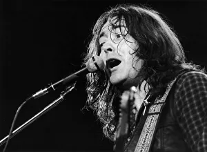 Irish blues rock musician and singer Rory Gallagher piuctured performing in concert