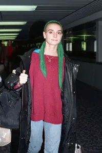 Head Scarf Prints: Irish singer Sinead O Connor arriving at Heathrow Airport. 19th October 1992