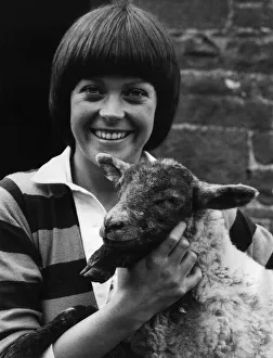 Lamb Prints: Isla St Clair actress with a lamb on location for the new series of The Farm