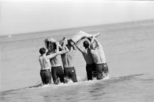 Isle of Man TT Races 1967. TT Riders dunk 19 year old Joyce Milton in the sea after