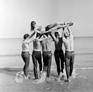Isle of Man TT Races 1967. TT Riders dunk 19 year old Joyce Milton in the sea after
