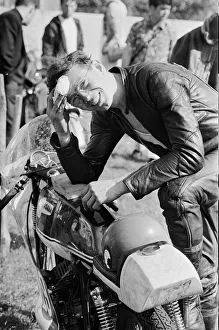 Isle of Man TT Races -250cc Event. An exhausted John Cooper after pushing his bike