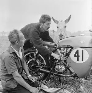Isle of Man TT Races. Bill Hawthorne and his mechanic Pat Lynch tuning up his BSA