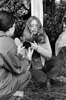 Hippy Collection: Isle of Wight Festival. A girl combing her hair. Left to right