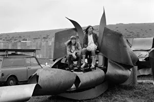Isle of Wight Festival. Two Swedish hippy types sitting on top of cars that look like