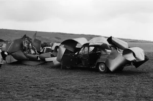 01369 Prints: Isle of Wight Festival. Two Swedish hippy types sitting on top of cars that look like