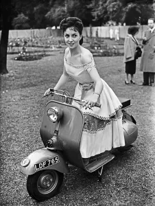 Scooter Prints: Italian actress Gina Lollobrigida attends the Sunday Pictorial Great Film Garden Party