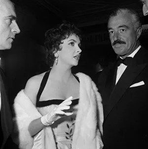 Formal Evening Prints: Italian film stars Gina Lollobrigida and Vittorio De Sica at the opening premiere of