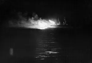 Convoy Prints: Italian MAS (Motor Torpedo Boat) boat attacks: A DIDO class cruiser firing at night