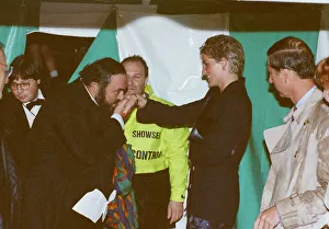 Kiss Prints: Italian opera singer Luciano Pavarotti kisses the hand of Princess Diana as Prince