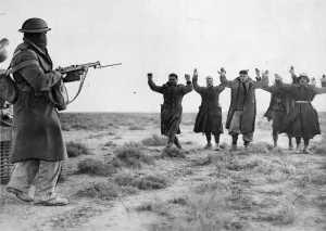 Italians soldiers surrendering to an Australian soldier in Bardia. January 1941