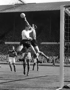 Italy goalkeeper Lorenzo Buffon saves from Peter Broadbent